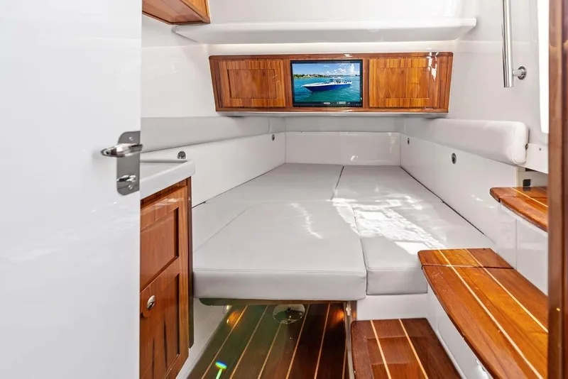 Slide: The Image of Luxurious interior of 2025 HCB 53 Suenos RXV boat with wood accents and seating. - 37