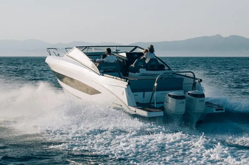 Slide: The Image of 2024 Beneteau Flyer 10 cruising on open water. - 15