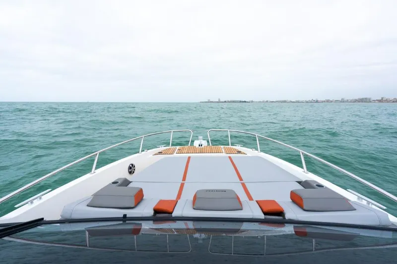 Slide: The Image of 2024 Beneteau Flyer 10 boat cruising on open water. - 22