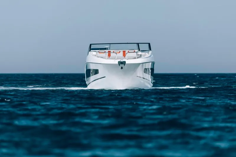 Slide: The Image of 2024 Beneteau Flyer 10 cruising on open water. - 3