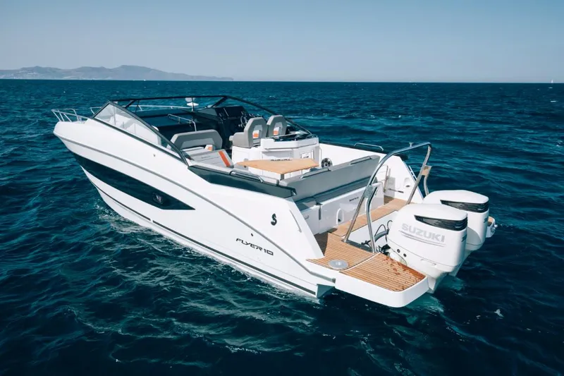 Slide: The Image of 2024 Beneteau Flyer 10 motorboat cruising on open water. - 6
