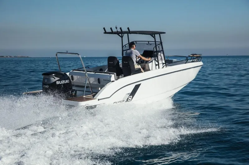 Slide: The Image of 2025 Beneteau Flyer 8 SPACEdeck boat cruising on open water. - 1