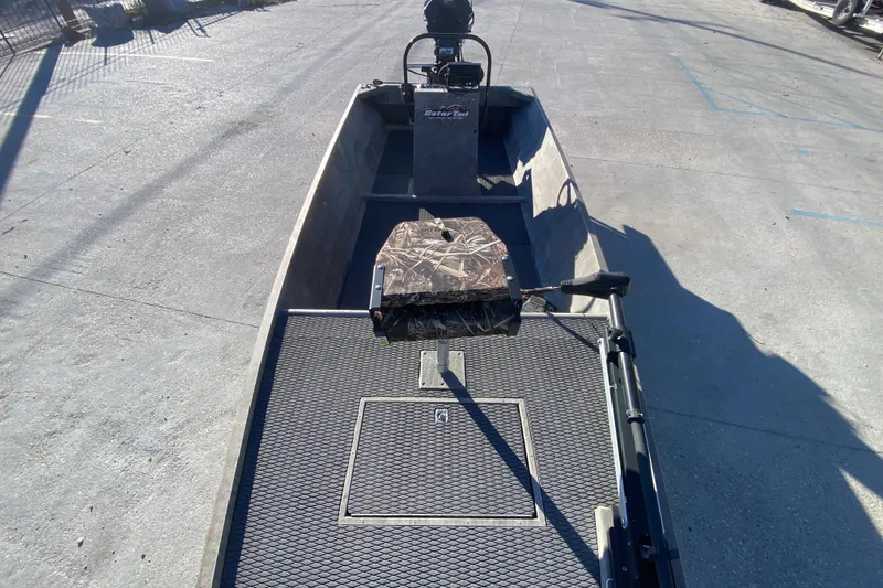 Slide: The Image of 2018 Gator Tail 17' boat with camouflage seat and textured flooring. - 10