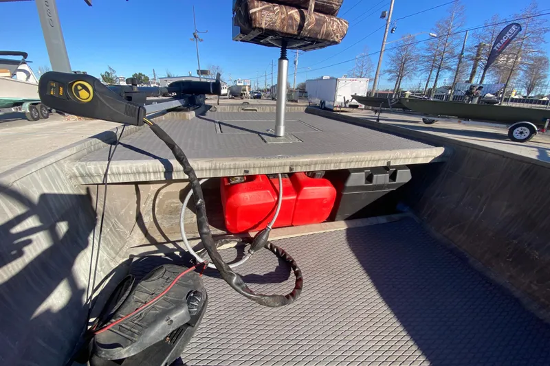 Slide: The Image of 2018 Gator Tail 17' boat interior with red fuel tanks and equipment. - 12