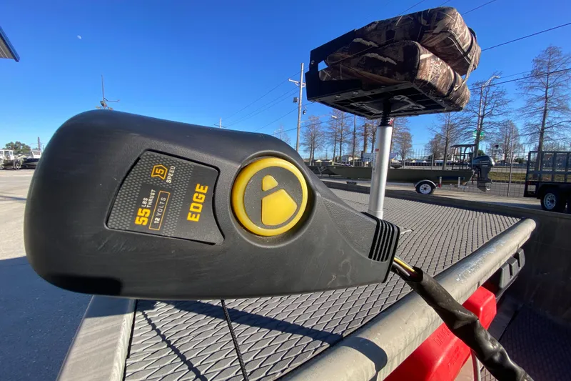 Slide: The Image of Electric trolling motor on a 2018 Gator Tail 17' boat, sunny day, outdoor setting. - 13