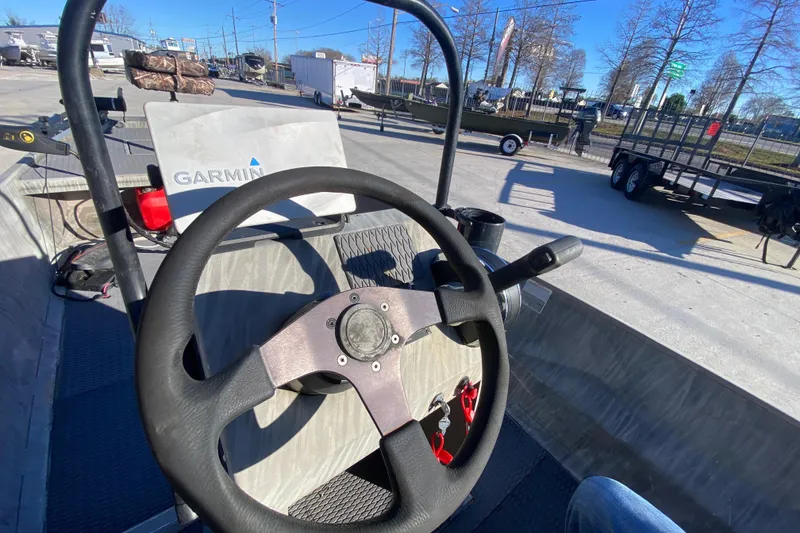 Slide: The Image of 2018 Gator Tail 17' boat with Garmin navigation system, steering wheel view. - 16