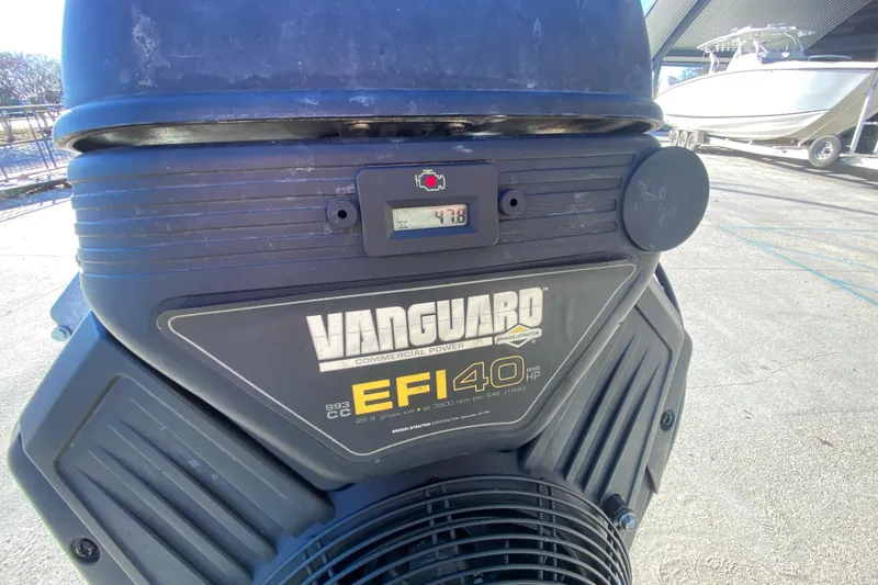 Slide: The Image of Vanguard EFI 40 HP engine on 2018 Gator Tail 17' boat, outdoor setting. - 21