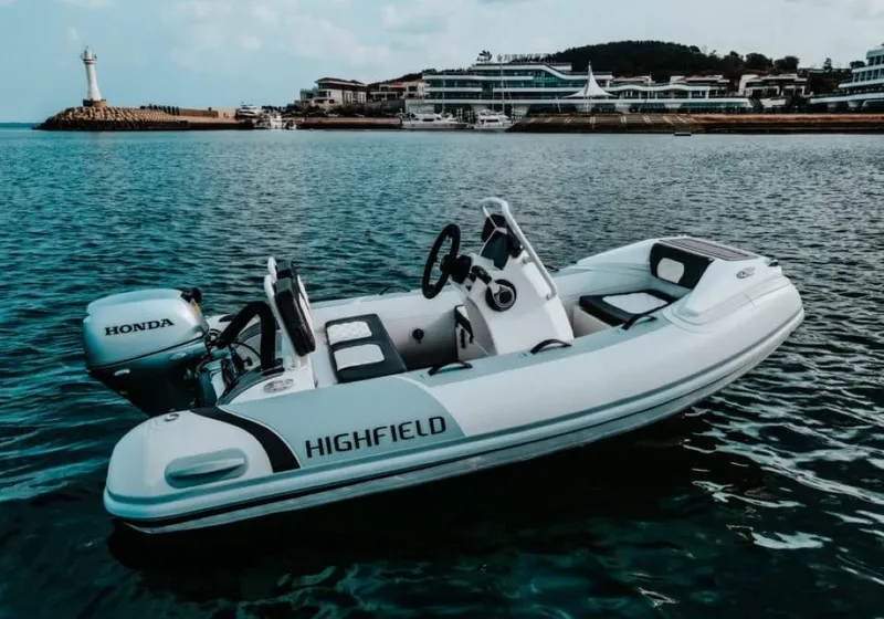 The Image of 2024 Highfield Sport 300 boat on water near marina. - 0