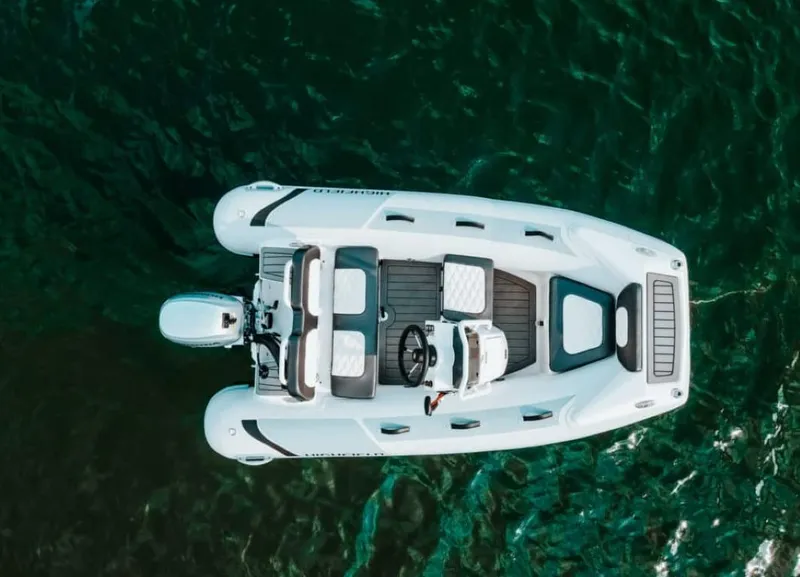 Slide: The Image of 2024 Highfield Sport 300 boat on water, aerial view. - 3