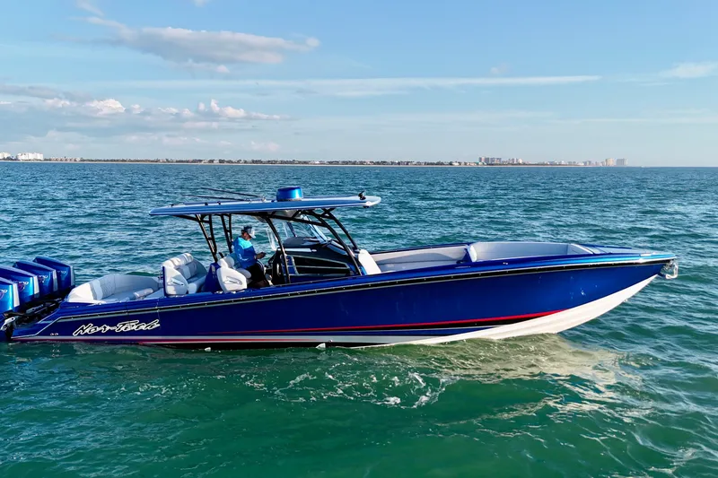 Slide: The Image of 2026 Nor-Tech 390 Sport Center Console boat cruising on open water. - 18