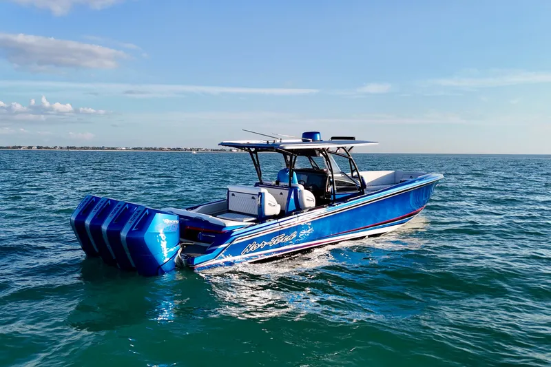 Slide: The Image of 2026 Nor-Tech 390 Sport Center Console boat cruising on open water. - 23