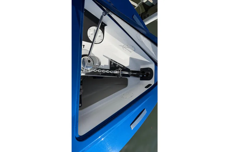 Slide: The Image of 2026 Nor-Tech 390 Sport Center Console anchor compartment, featuring a sleek blue design. - 32