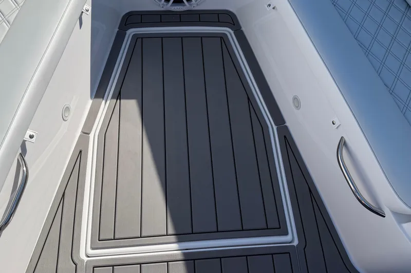 Slide: The Image of 2026 Nor-Tech 390 Sport Center Console boat deck with sleek seating and modern design. - 37