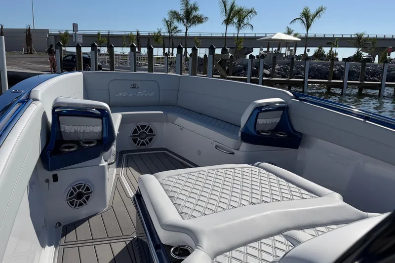 Slide: The Image of 2026 Nor-Tech 390 Sport Center Console boat interior with luxurious seating and modern design. - 39