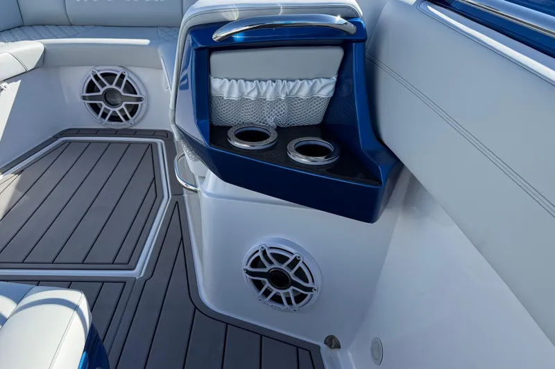 Slide: The Image of 2026 Nor-Tech 390 Sport Center Console interior with cup holders and speakers. - 41