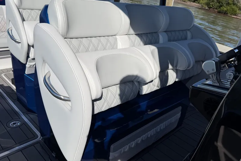 Slide: The Image of Luxury seating on 2026 Nor-Tech 390 Sport Center Console boat, featuring elegant design and comfort. - 51