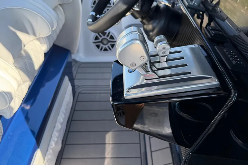 Slide: The Image of 2026 Nor-Tech 390 Sport Center Console throttle controls and steering wheel detail. - 52