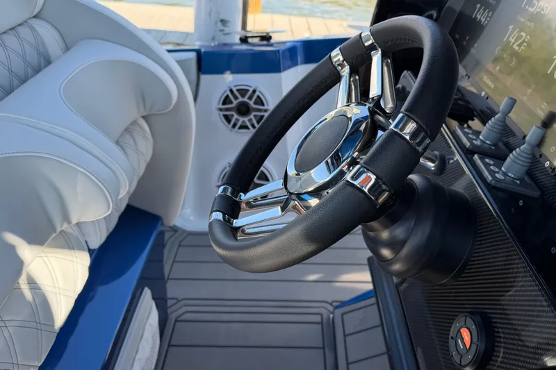 Slide: The Image of 2026 Nor-Tech 390 Sport Center Console steering wheel and dashboard close-up. - 53