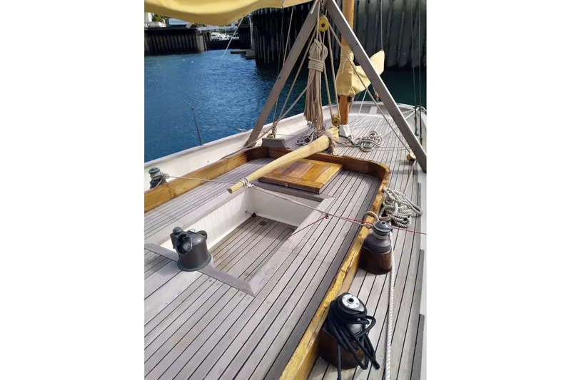 Slide: The Image of Deck of 2012 Custom Mayflower 50 sailboat with wooden finish and nautical equipment. - 11
