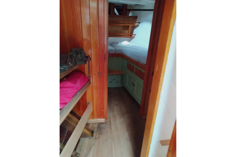 Slide: The Image of Cozy cabin interior of 2012 Custom Mayflower 50 boat with wooden furnishings. - 15