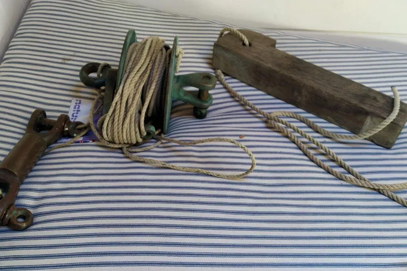 Slide: The Image of Vintage nautical equipment with ropes on striped fabric, Custom Mayflower 50, 2012. - 17