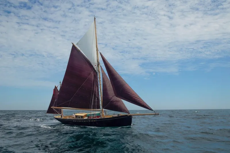 Slide: The Image of Sailing yacht "Mayflower 50" on open sea under blue sky, 2012 model. - 2