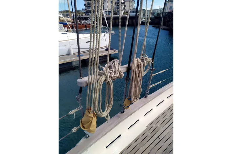 Slide: The Image of Ropes and rigging on a 2012 Custom Mayflower 50 sailboat docked at a marina. - 8