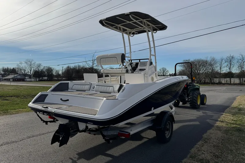 Slide: The Image of 2017 Yamaha Boats 190 FSH Sport on trailer, parked outdoors. - 3