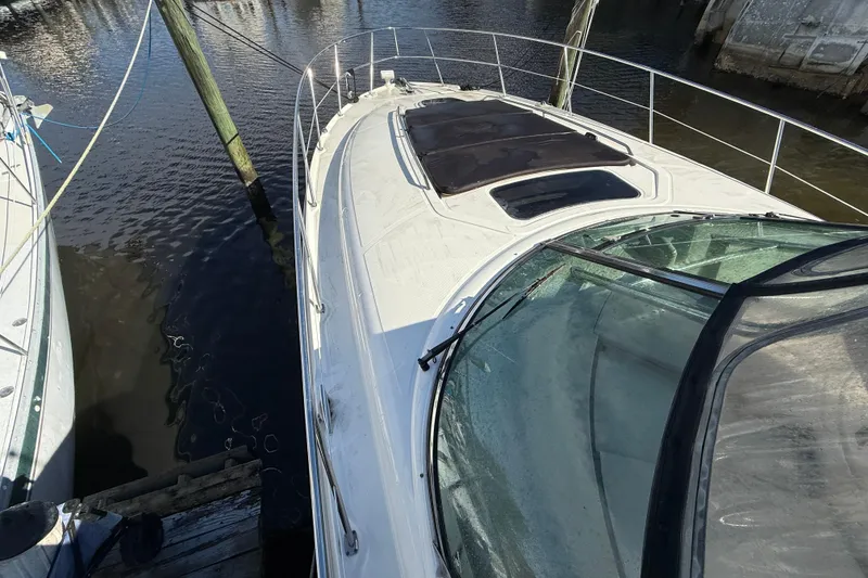 Slide: The Image of 2005 Sea Ray 390 Sundancer yacht docked at marina, top view. - 16