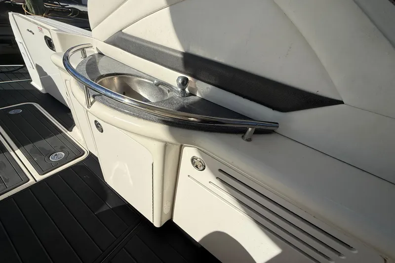 Slide: The Image of 2005 Sea Ray 390 Sundancer boat interior with sink and storage area. - 9