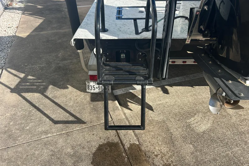 Slide: The Image of Rear view of a 2021 Shallow Stalker Cat 240 Pro Elite boat with ladder and propeller. - 10