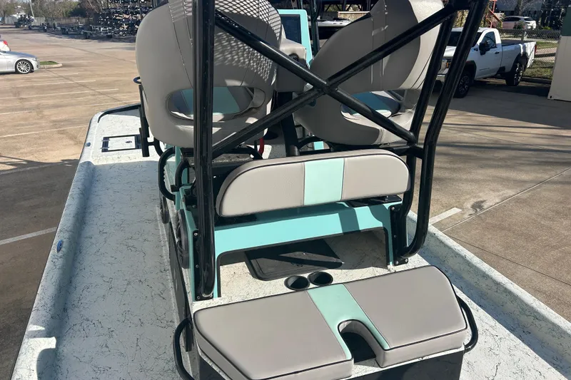 Slide: The Image of 2021 Shallow Stalker Cat 240 Pro Elite boat interior with seating and cup holders. - 15