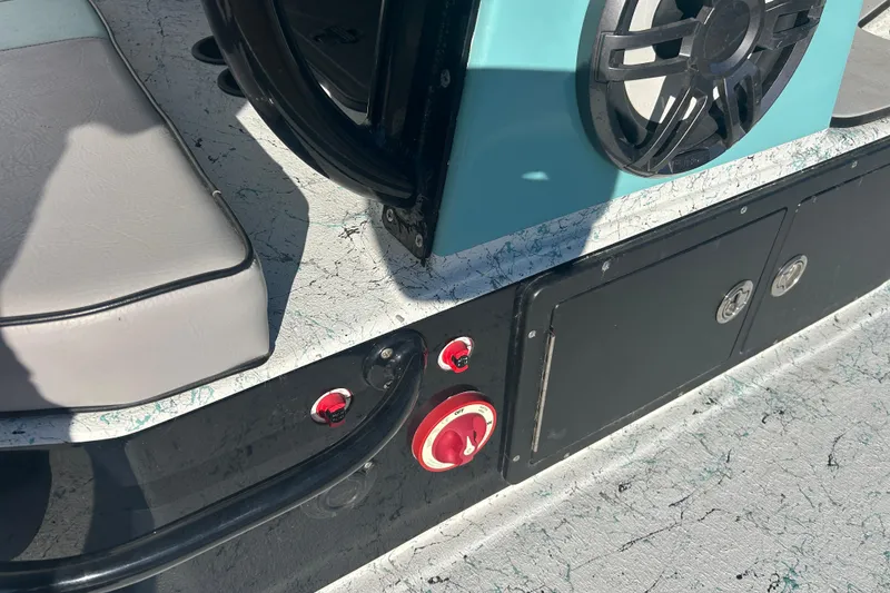 Slide: The Image of 2021 Shallow Stalker Cat 240 Pro Elite boat interior with speaker and control panel. - 16