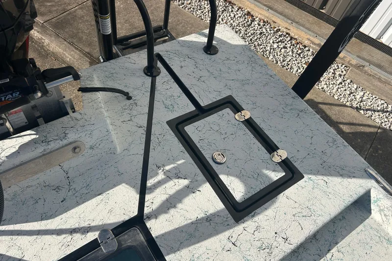 Slide: The Image of 2021 Shallow Stalker Cat 240 Pro Elite boat deck with hatch and motor details. - 17