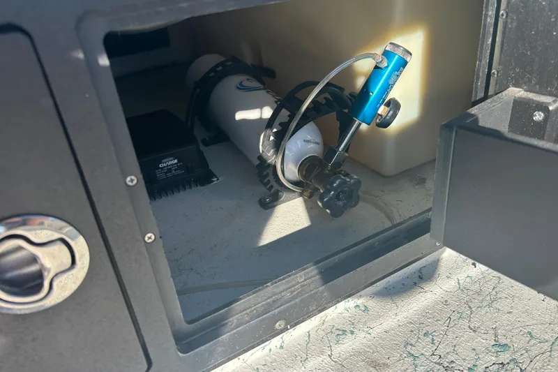 Slide: The Image of Compartment of 2021 Shallow Stalker Cat 240 Pro Elite with equipment and storage. - 21