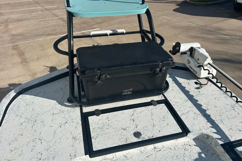 Slide: The Image of 2021 Shallow Stalker Cat 240 Pro Elite boat deck with cooler and trolling motor. - 33