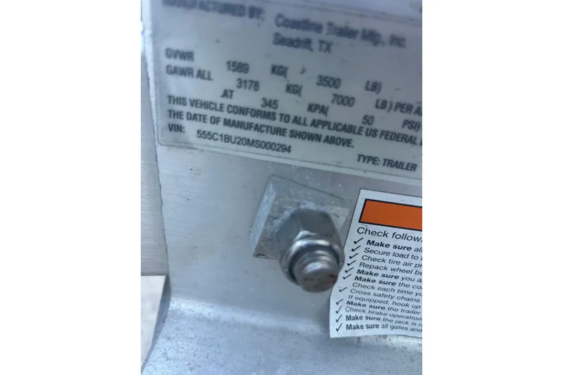Slide: The Image of Label on trailer with specifications and safety checklist, featuring a visible bolt. - 36