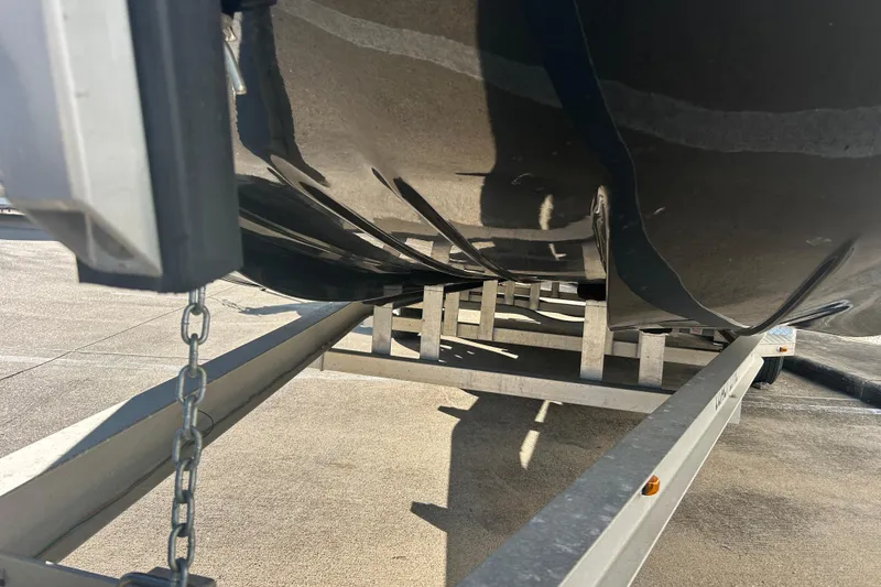 Slide: The Image of 2021 Shallow Stalker Cat 240 Pro Elite boat hull on trailer. - 7