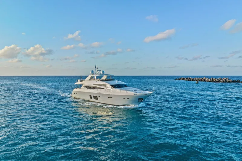 Slide: The Image of Luxurious 2011 Princess 95 yacht cruising on open blue sea under clear sky. - 10