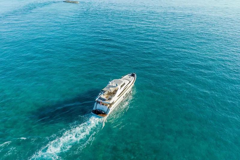 Slide: The Image of Luxurious 2011 Princess 95 yacht cruising on clear blue ocean waters. - 14