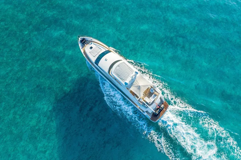 Slide: The Image of Aerial view of 2011 Princess 95 yacht cruising in clear turquoise waters. - 15