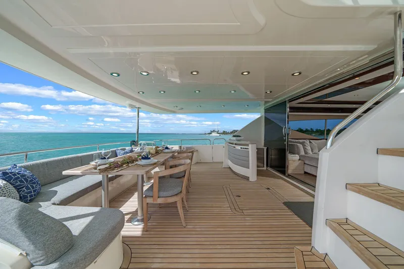 Slide: The Image of Luxurious 2011 Princess 95 yacht deck with elegant seating and ocean view. - 21