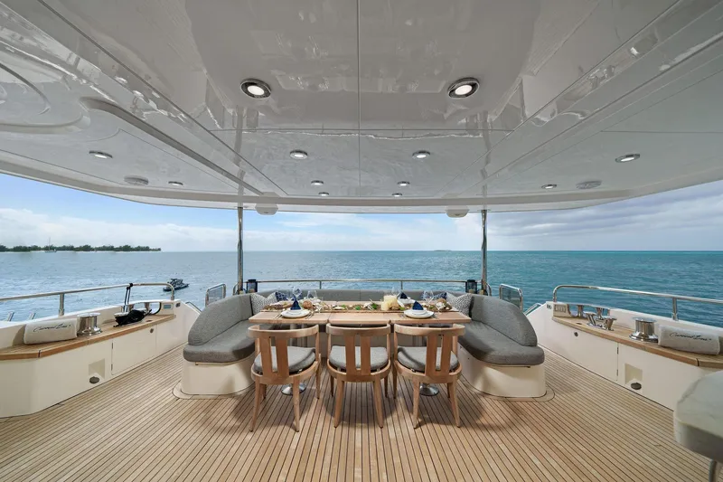 Slide: The Image of Luxurious 2011 Princess 95 yacht deck with elegant dining setup overlooking the ocean. - 23