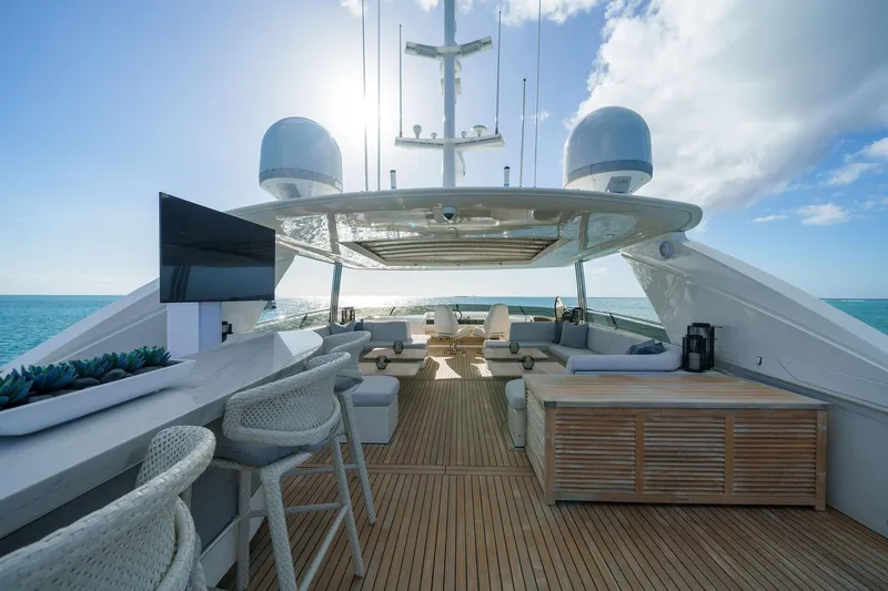 Slide: The Image of Luxurious 2011 Princess 95 yacht deck with seating, bar, and ocean view. - 26