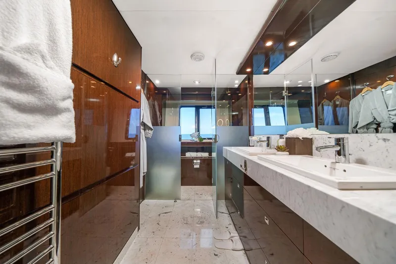 Slide: The Image of Luxurious yacht bathroom with marble countertops, wooden accents, and modern fixtures on a 2011 Princess 95. - 40