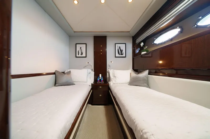 Slide: The Image of Luxurious twin cabin interior on 2011 Princess 95 yacht, featuring elegant decor and modern amenities. - 47