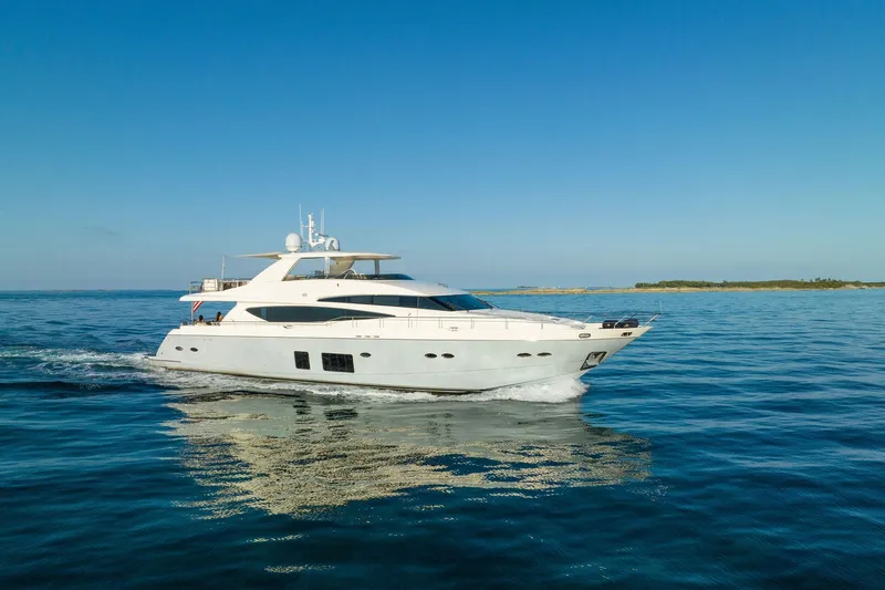 The Image of Luxurious 2011 Princess 95 yacht cruising on serene blue waters at sunset. - 1