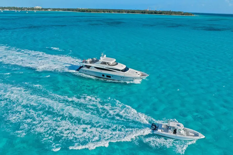 Slide: The Image of Luxurious 2011 Princess 95 yacht cruising in clear turquoise waters near a tropical island. - 12