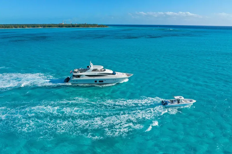 Slide: The Image of Luxurious 2011 Princess 95 yacht cruising on clear blue ocean waters. - 13