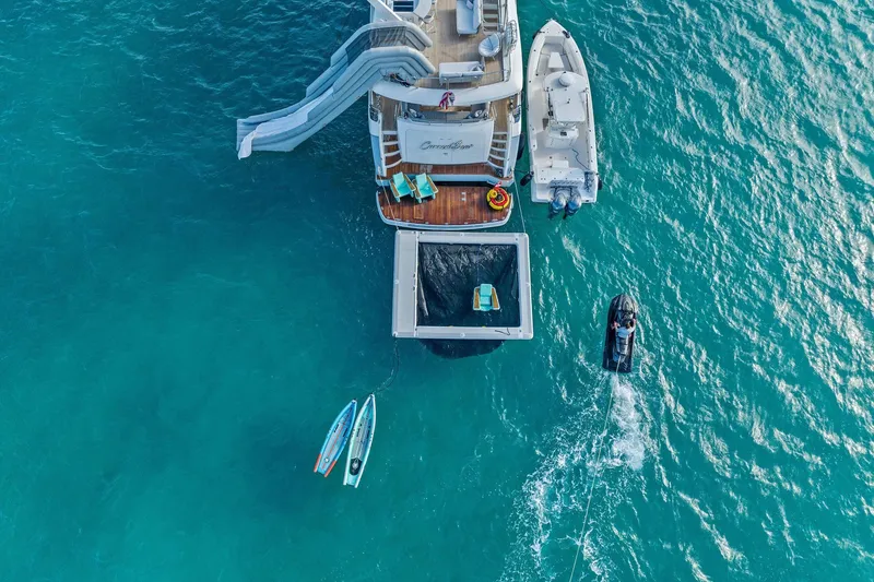 Slide: The Image of Luxurious 2011 Princess 95 yacht with spacious deck, seating, and ocean view. - 19